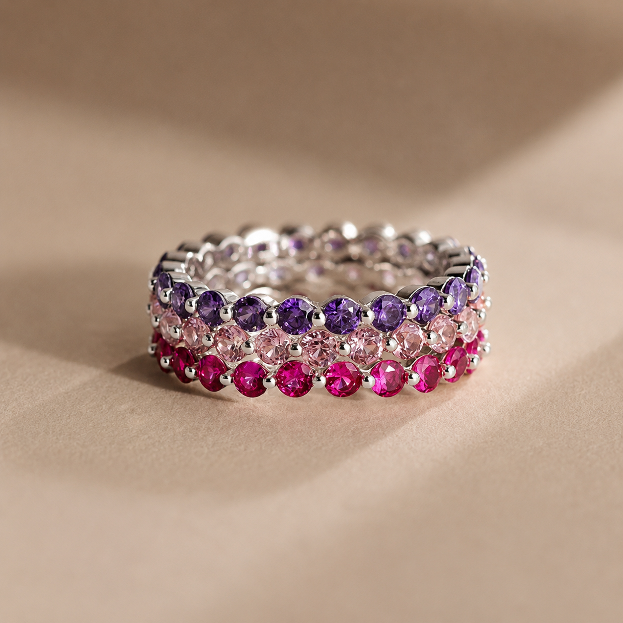 Multicolored gemstone ring on a beige background